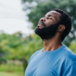Portrait of a man breathing fresh air in nature